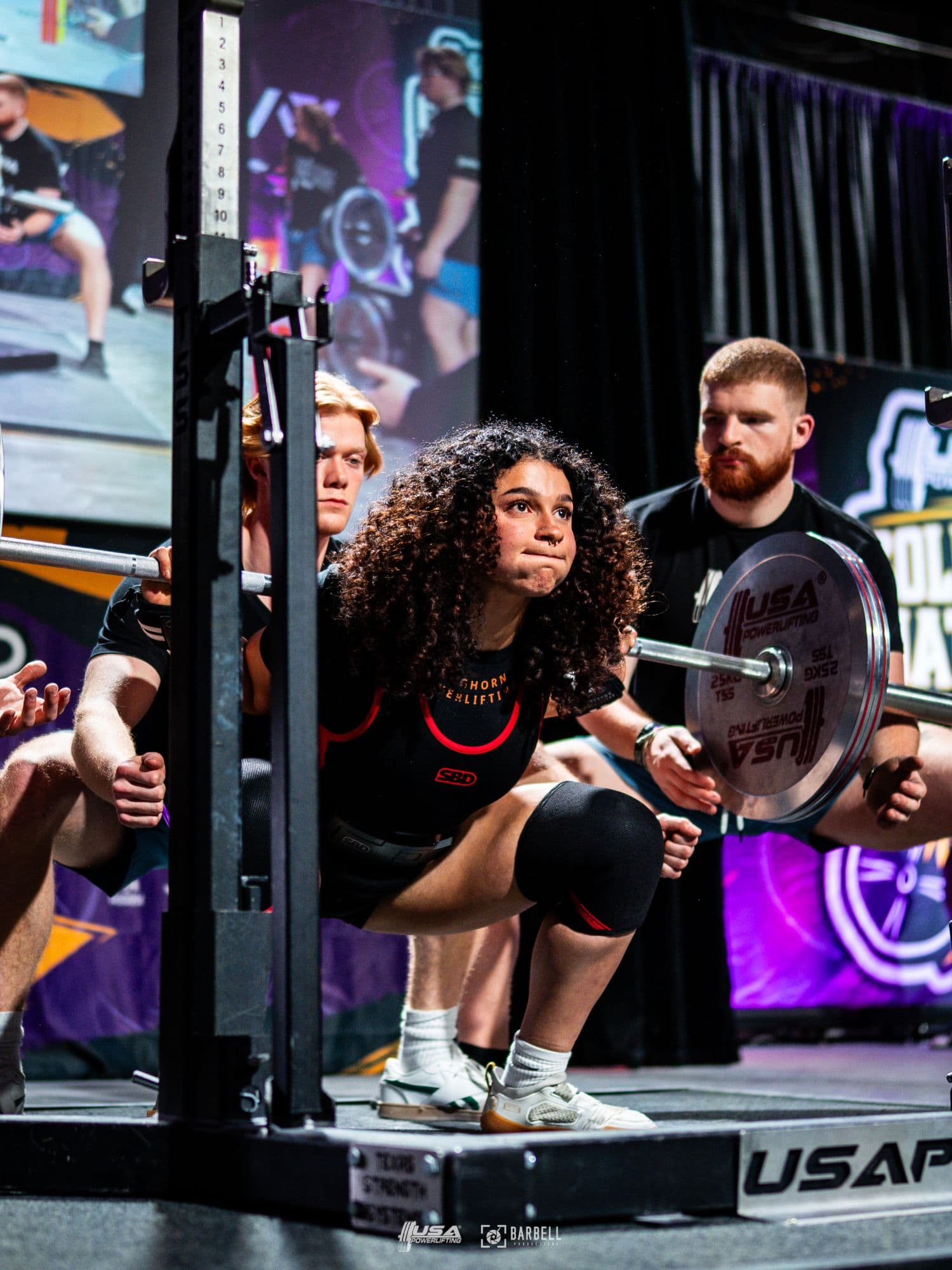 Sara Pishkar at the bottom of a competition squat
